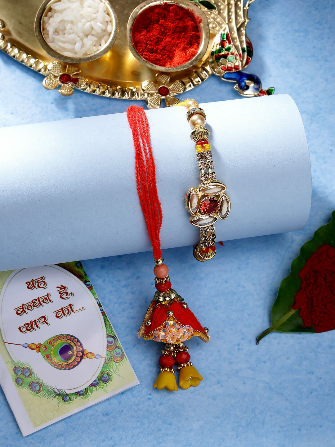 NVR Women & Men Set of 2 Red & Gold-Toned Stone-Studded Bhaiya Bhabhi Rakhi With Roli Chawal | Swadesiicart