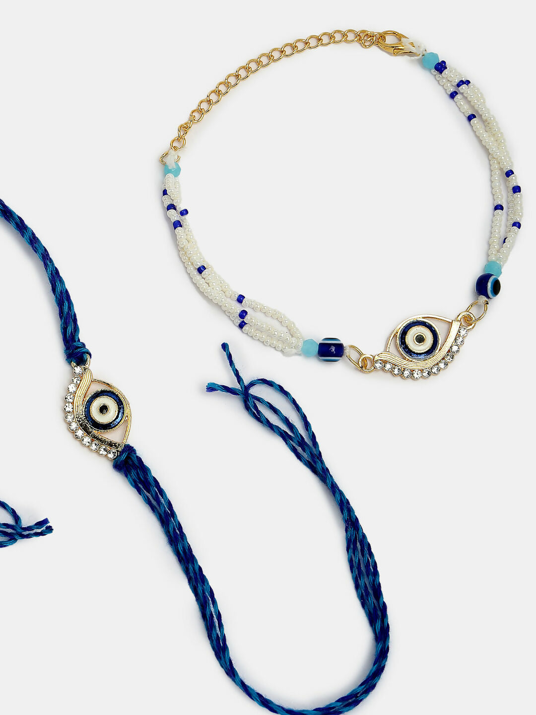 NVR Women & Men Set of 2 Blue Evil Eye Bhaiya Bhabhi Rakhi Set With Roli Chawal | Swadesiicart