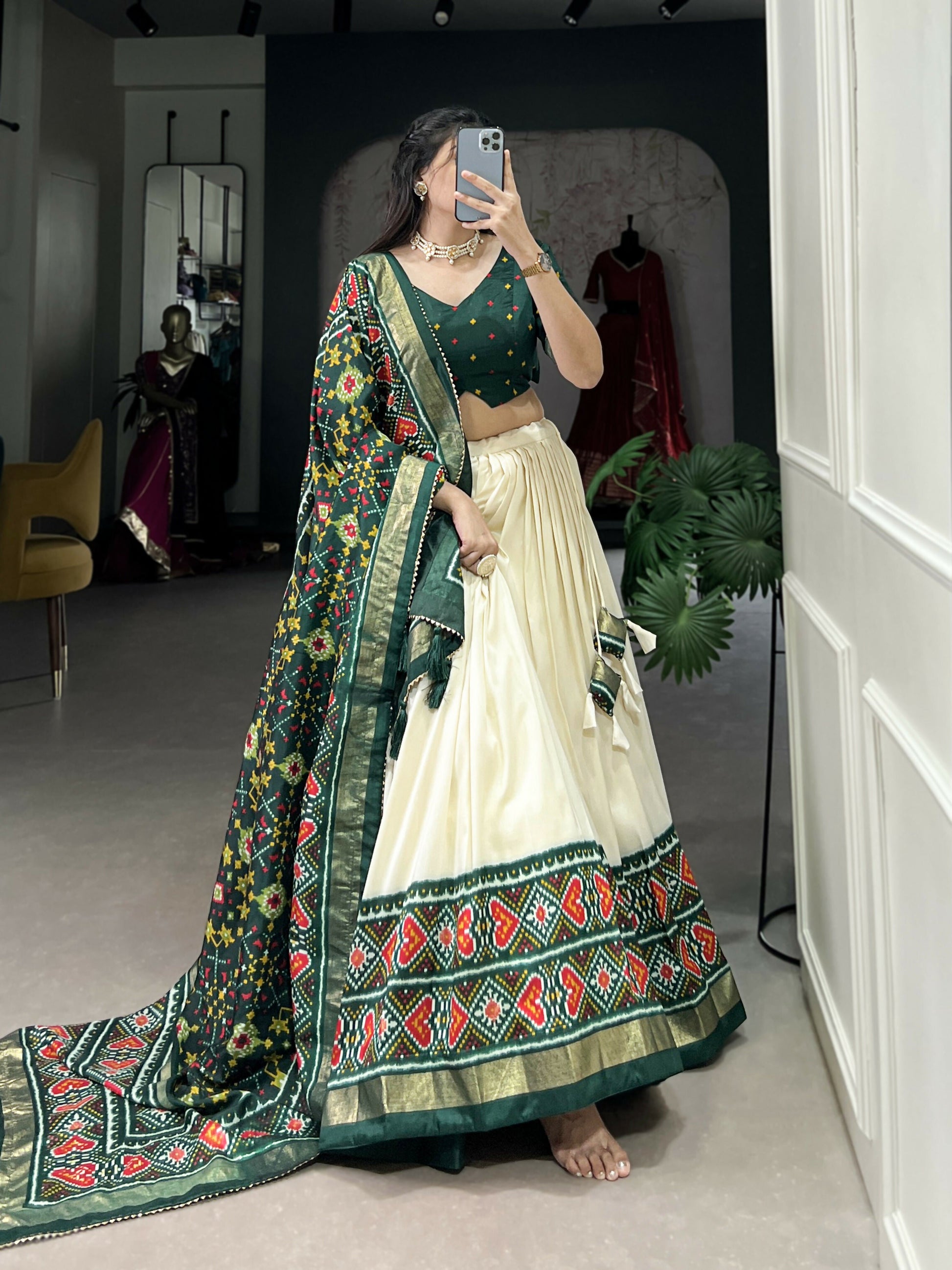 Lorenvalley Offwhite and Green Tussar Silk Patola Print Lehenga Choli | Swadesiicart