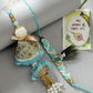 NVR Women & Men Set of 2 Blue Krishna Pearl Bhaiya Bhabhi Rakhi With Roli Chawal & Chocolate | Swadesiicart