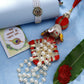 NVR Women & Men Set of 2 White Pearl Bhaiya Bhabhi Rakhi With Roli Chawal & Chocolate | Swadesiicart