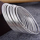 Silver-Plated Alloy Set Of 12 Silver Metal Bangles - The Pari - Swadesiicart