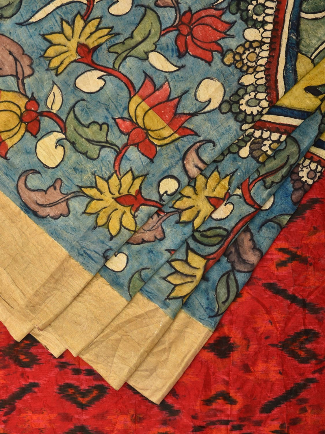 Blue and Red Kalamkari Hand Painted Ikat Silk Handloom Saree with Lotus and Krishna Design - Global Threads | Swadesiicart