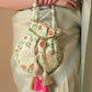 Masq Green & Red Embroidered Potli Clutch - Swadesiicart