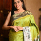 Very Much Indian Premium Handloom Pure Silk Muniya Borde-Parrot Green,Silver Zari And Intricate Big Radha Krishna Pallu | Swadesiicart