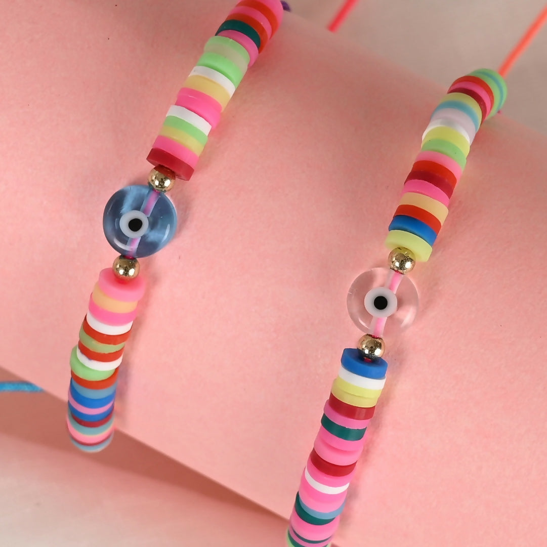 NVR Women & Men Set of 2 Multicolor Evil Eye Rakhi With Roli Chawal | Swadesiicart