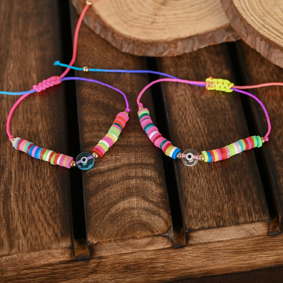 NVR Women & Men Set of 2 Multicolor Evil Eye Rakhi With Roli Chawal | Swadesiicart