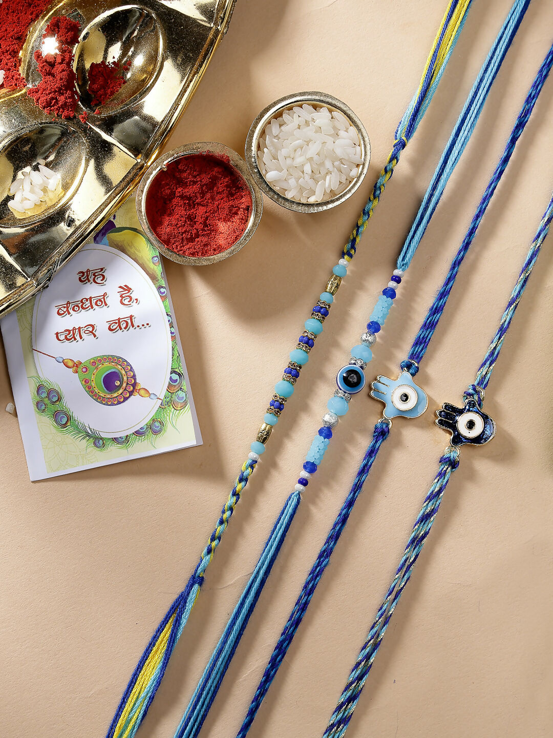NVR Women & Men Set of 4 Blue Evil Eye Charm Rakhi With Roli Chawal & Chocolate | Swadesiicart