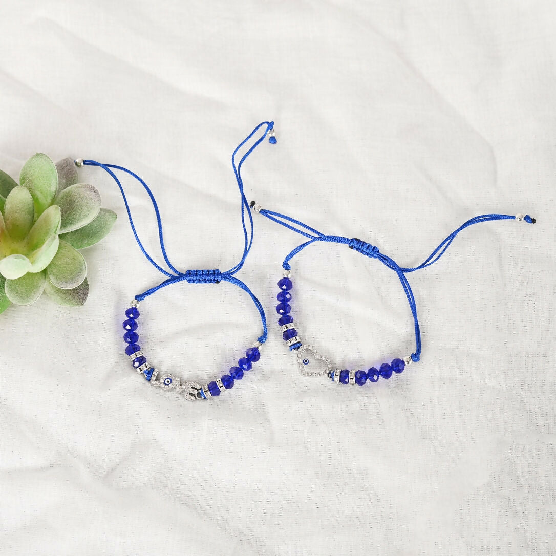 NVR Women & Men Set of 2 Blue Evil Eye Rakhi With Roli Chawal | Swadesiicart