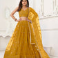 Aastha Fashion Mustard Yellow Butterfly Net Tone To Tone Thread Work And Sandwich Sequence Work Embroidery Wedding Wear Lehenga Choli