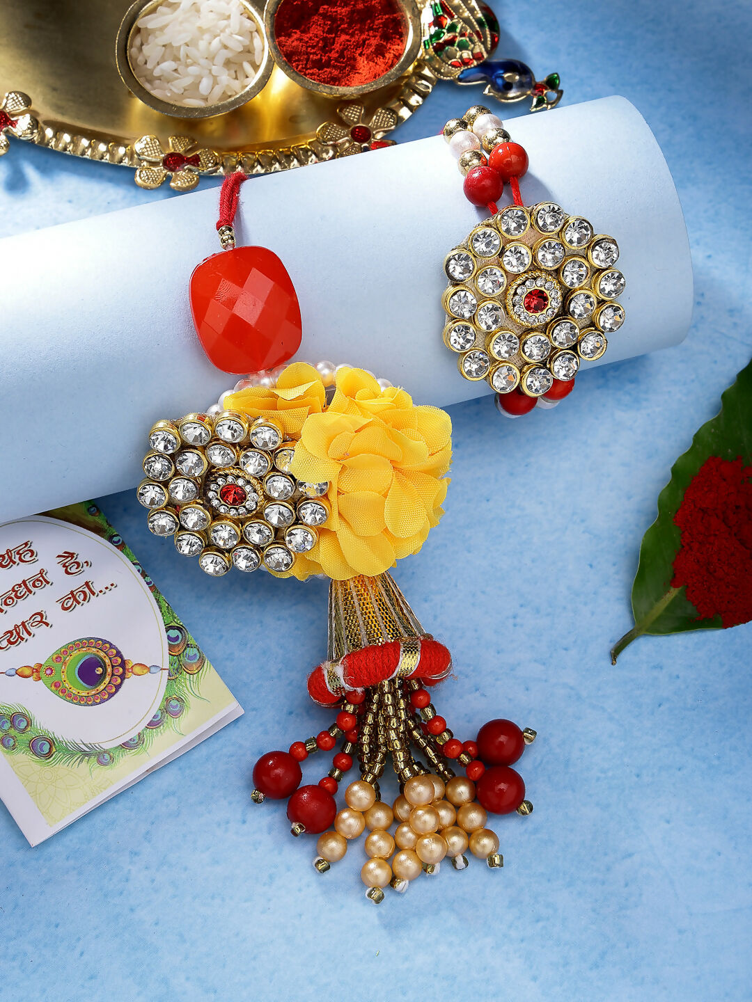 NVR Women & Men Set of 2 Red & Gold-Toned Stone-Studded & Beaded Bhaiya Bhabhi Rakhi With Roli Chawal | Swadesiicart