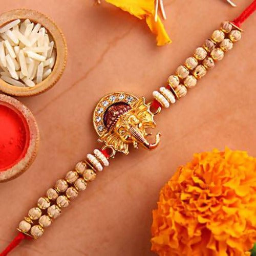 Beautiful Ganesha Rakhi and Almonds Jar