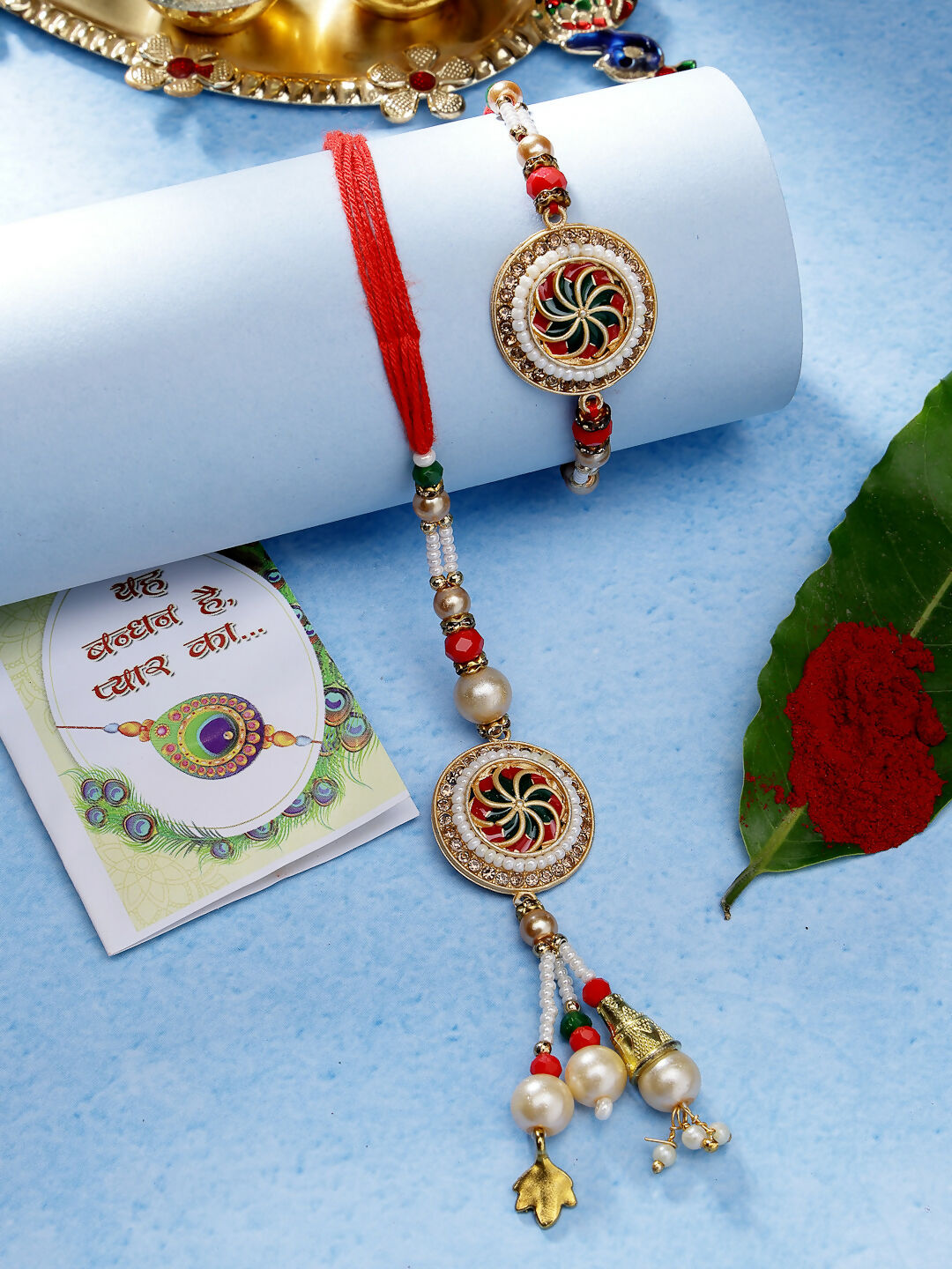 NVR Women & Men Set of 2 Gold-Toned Stone-Studded & Beaded Bhaiya Bhabi Rakhi With Roli Chawal | Swadesiicart