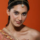 Gold-Polished White Faux Kundan-Studded Faux Pearl Beaded Handcrafted Matha Patti - Ruby Raang | Swadesiicart