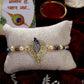 NVR Men Gold-Toned Peacock Design Stone-Studdded Rakhi With Roli Chawal | Swadesiicart
