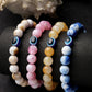 NVR Women & Men Set of 4 Multicolor Evil Eye Elasticated Rakhi With Roli Chawal | Swadesiicart