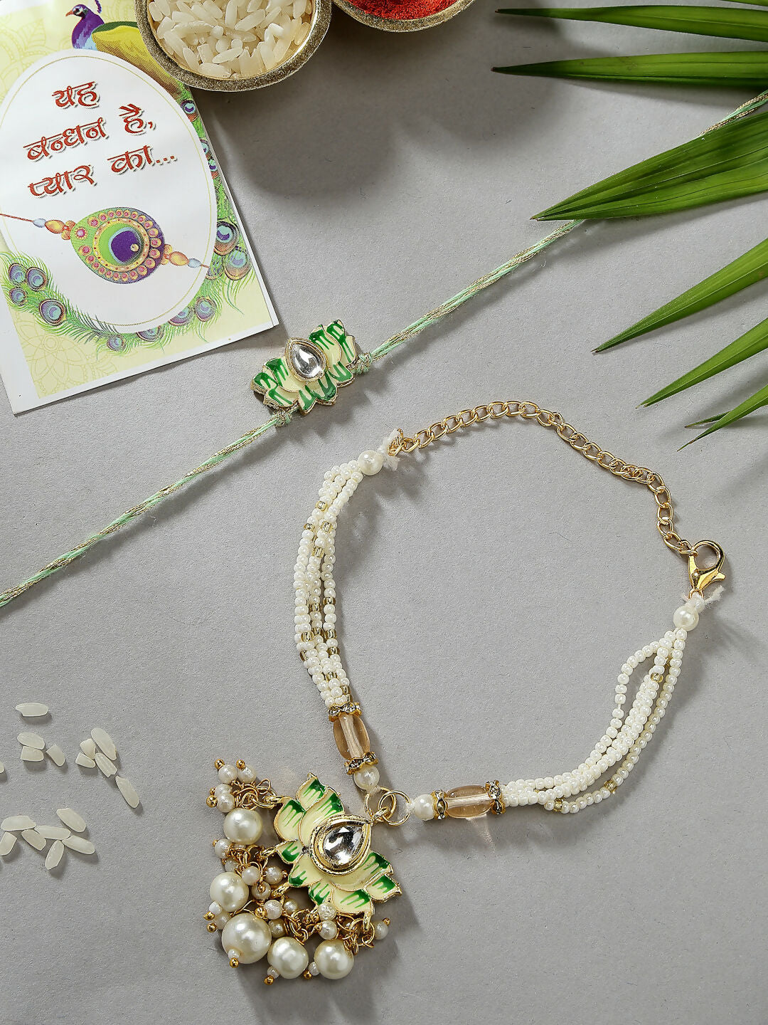 NVR Women & Men Set of 2 Green Lotus Shape Kundan-Studded & Beaded Wraparound Rakhi Set With Roli Chawal & Chocolate | Swadesiicart
