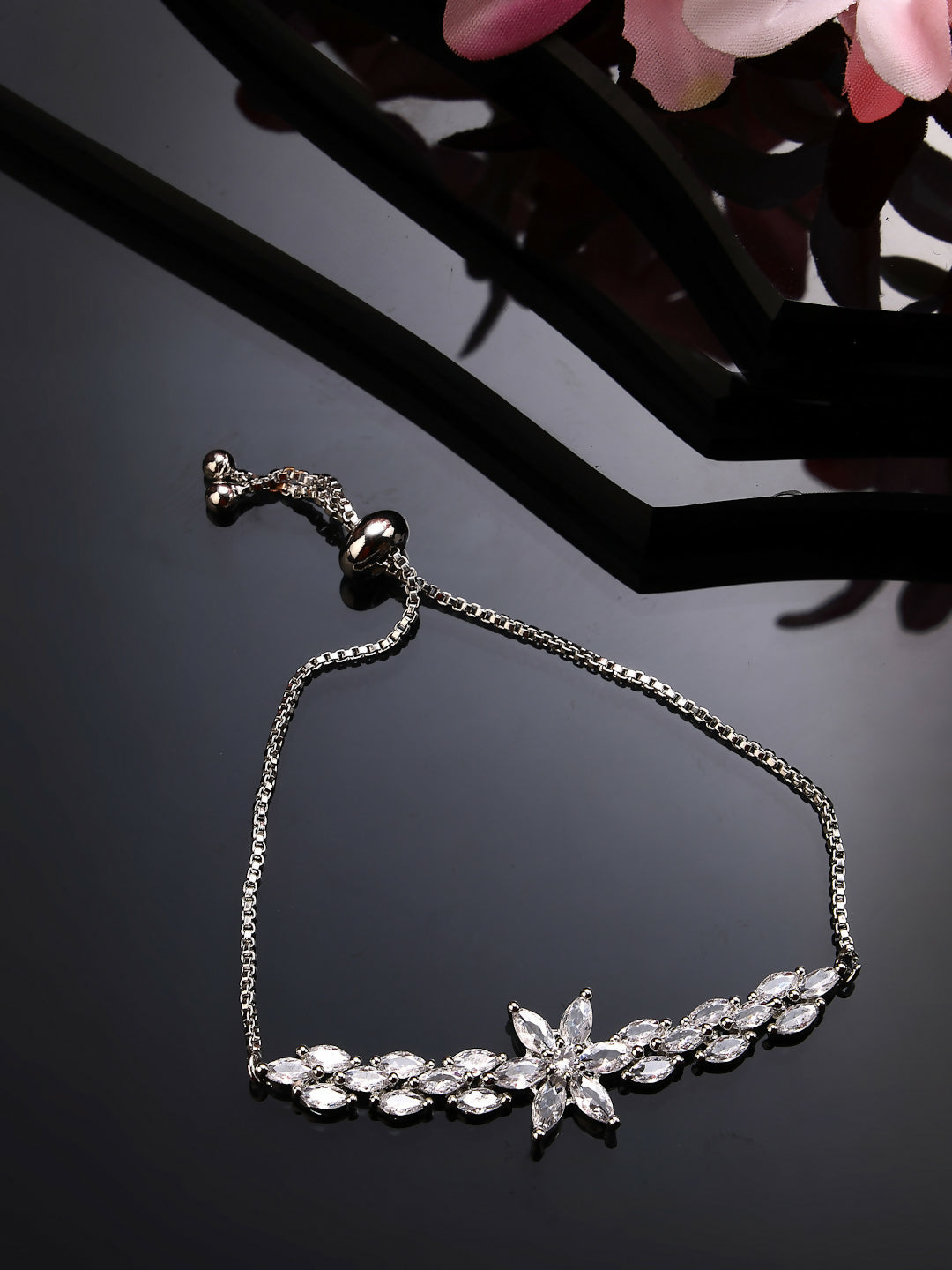 NVR Women Silver-Plated American Diamond Studded Rakhi With Roli Chawal | Swadesiicart