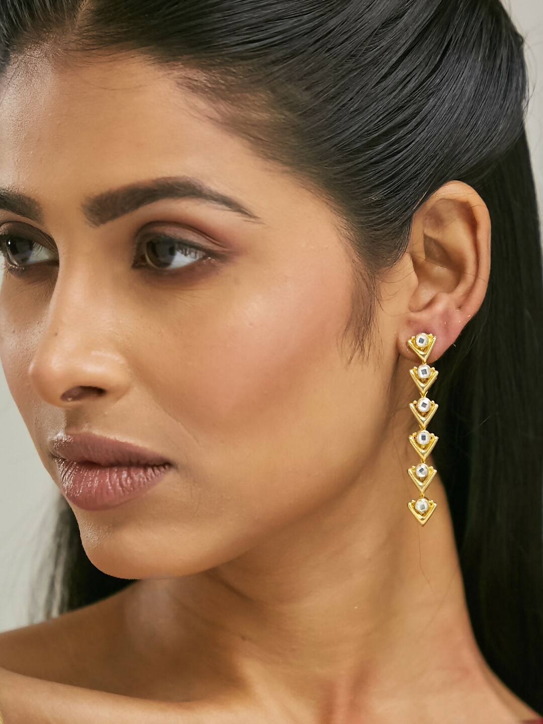 Nuyug 18K Gold-Plated Crystal Stone Studded Triangular Drop Sleek Earrings | Swadesiicart