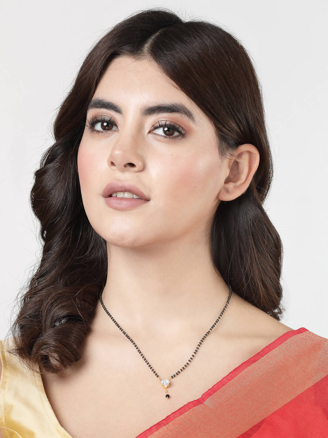 NVR Women Ethnic Gold-Polished Beaded Mangalsutra With Ad Stone - Swadesiicart