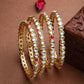 NVR Women Set of 4 Gold-Polished Kundan Studded Bangles - Swadesiicart