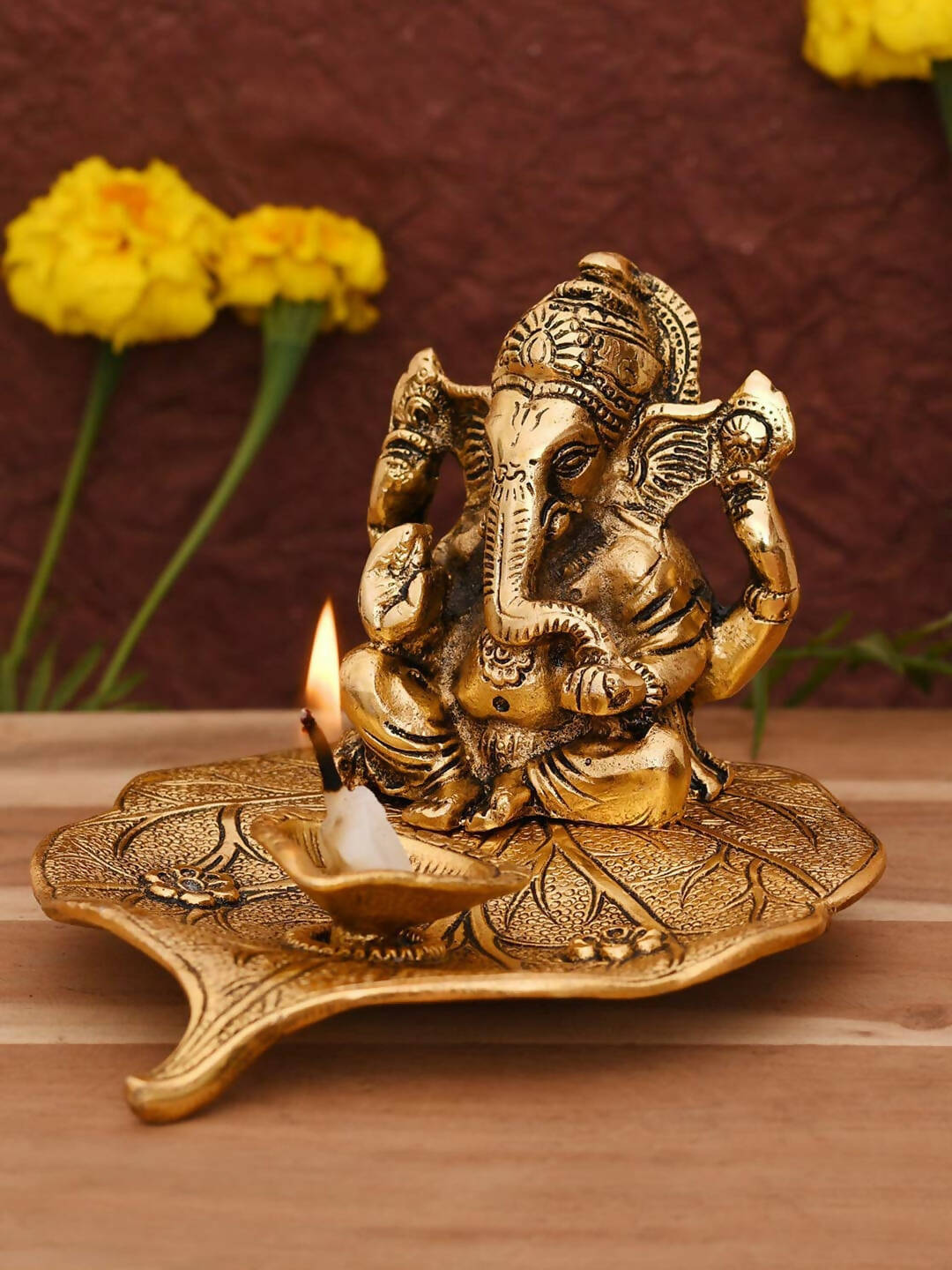 CraftVatika Gold Toned Aluminium Ganesh with Diya Idol | Swadesiicart