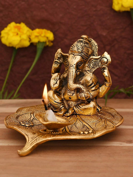 CraftVatika Gold Toned Aluminium Ganesh with Diya Idol | Swadesiicart