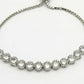 NVR Women Silver-Plated American Diamond Studded Rakhi With Roli Chawal | Swadesiicart