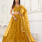 Aastha Fashion Mustard Yellow Butterfly Net Tone To Tone Thread Work And Sandwich Sequence Work Embroidery Wedding Wear Lehenga Choli