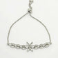 NVR Women Silver-Plated American Diamond Studded Rakhi With Roli Chawal | Swadesiicart